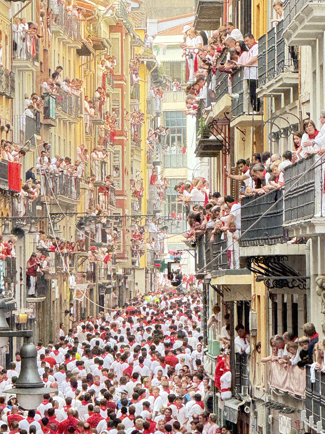 private balcony view of the running of the bulls in pamplona