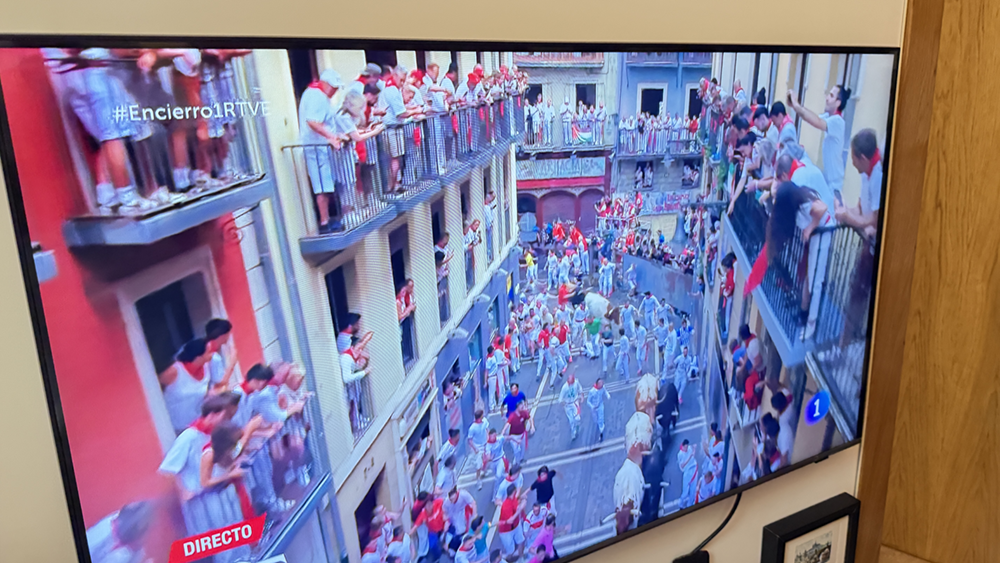 Television showing the Running of the Bulls inside a Pamplona home