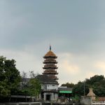 Stunning view of Che Chin Khor Pagoda against a gray sky by Chao Phraya River, Thailand.