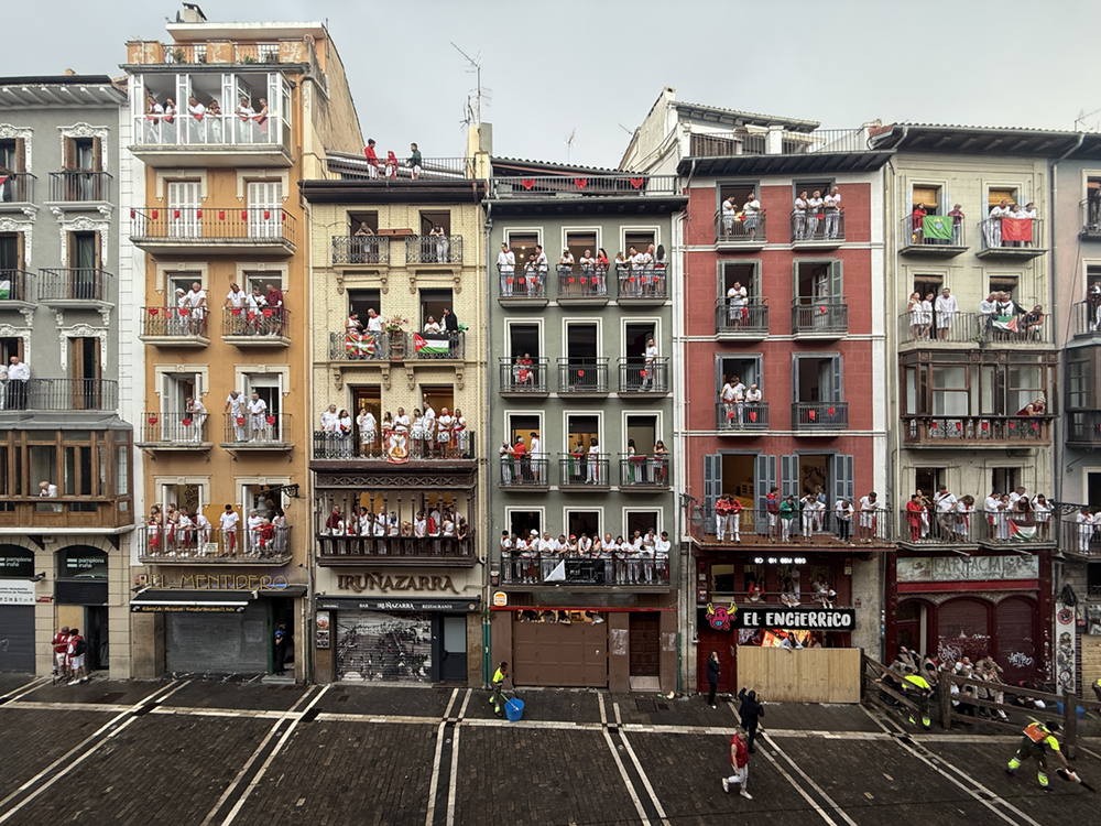 San Fermín balcony view in Pamplona with spectators watching from local buildings